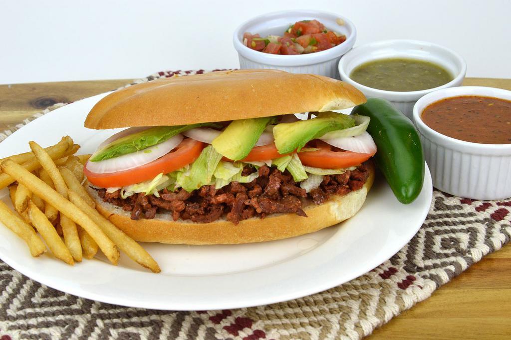 Tortas · One choice of meat served with lettuce, beans, tomato, avocado, mayonnaise, onion, and side of fries.