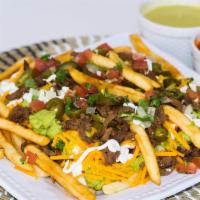 Carne Asada Fries (Papas) · Pilled Fries topped with Carne Asada meat, cheese, pico de gallo, guacamole, sour cream, and...