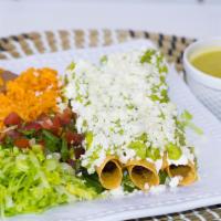 Flautas Plate · 3 Rolled-up tortillas filled with beef or chicken, topped with queso fresco and guacamole, s...
