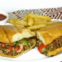 Philly Cheese Steak · Served with onions, bell peppers, cheese, mayonnaise, and side of fries.