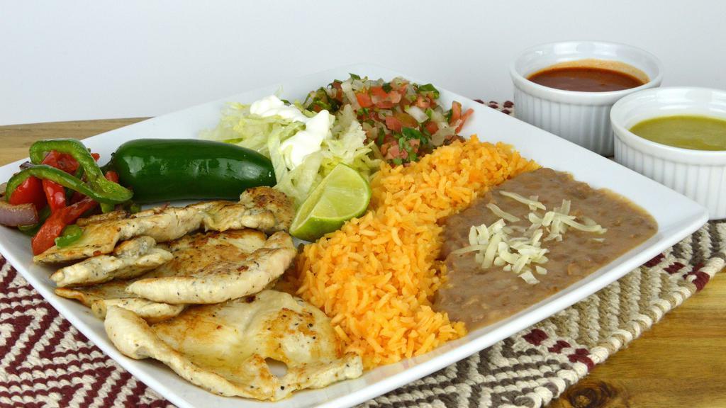 Pollo Asado Plate · Grilled Chicken platter served with grilled onions, lettuce, pico de gallo, avocado, and side of rice and beans.