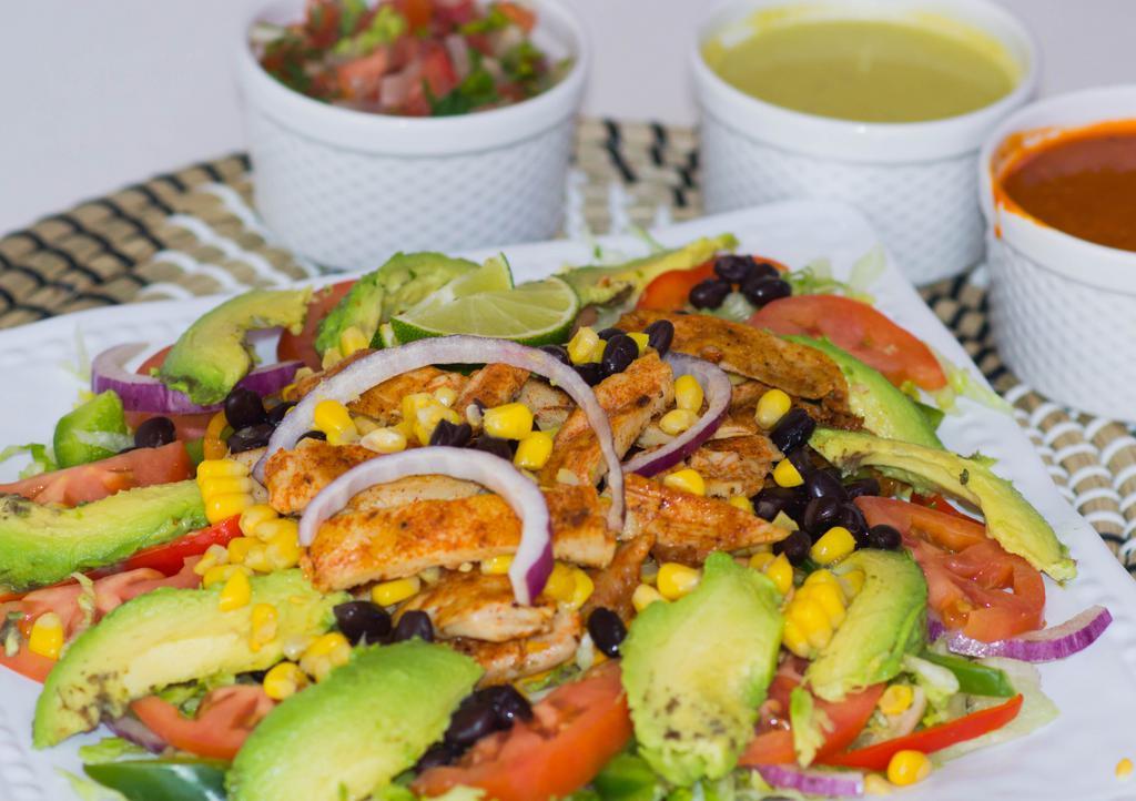Chicken Salad · Grilled Chicken salad made with lettuce, tomatoes, red onions, avocado, corn, and black beans.