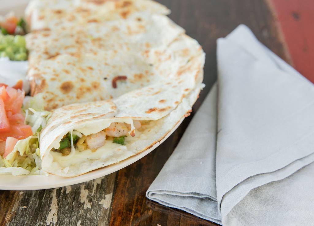 Quesadilla · Our most popular item! Grilled tortilla, Monterey jack cheese, pico de gallo and your choice of meat. Served with guacamole, sour cream, jalapeños, and sautéed onions.