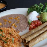 Flautas · Two chicken flautas rolled in corn tortillas fried and lightly topped with ranchero sauce or...