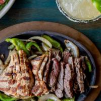 Fajitas De Cristina'S · Grilled, marinated & seasoned with sautéed onions & bell peppers. Served with guacamole, sou...