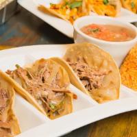 Brisket Tacos · Slow roasted beef brisket in corn tortillas with sautéed onion,􀀀 poblano peppers & melted j...
