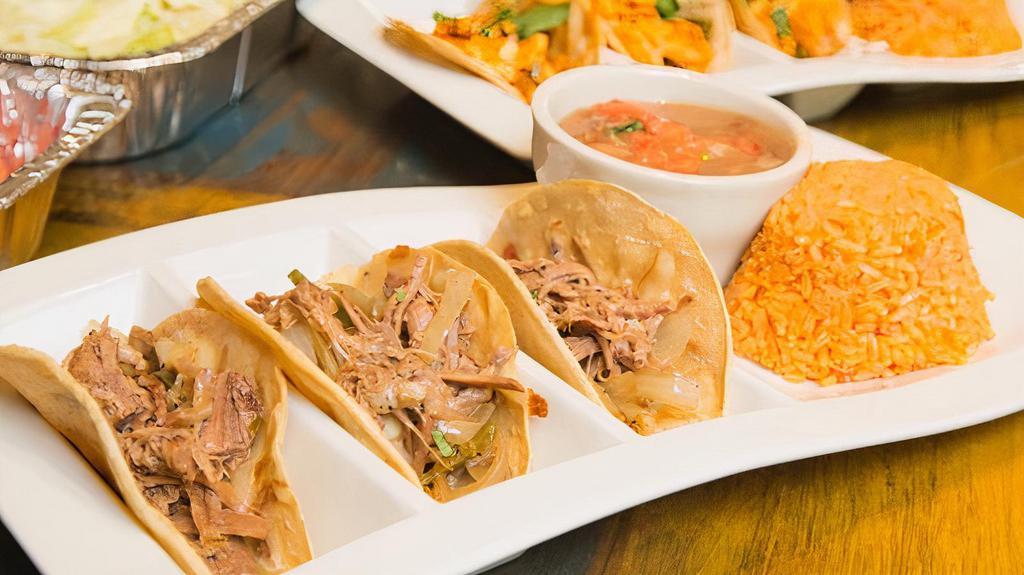 Brisket Tacos · Slow roasted beef brisket in corn tortillas with sautéed onion,􀀀 poblano peppers & melted jack cheese.