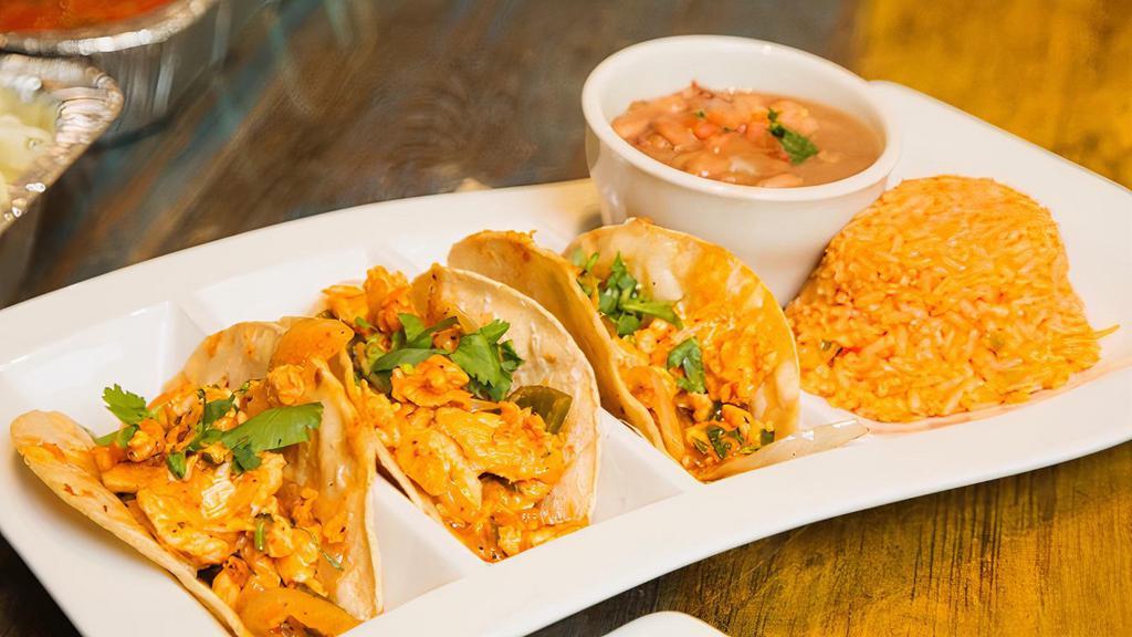 Shrimp Tacos · Sautéed shrimp & smoky bacon in a rich guajillo chile sauce served in􀀀 corn tortillas with melted jack cheese.