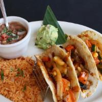 Veggie Tacos · Seasoned fresh sauteed vegetable in corn tortillas with toasted jack cheese. My bueno.