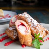 Raspberry Cheesecake Chimi'S · Golden fried mini chimi's filled with delicious raspberry cheesecake perfect for one or shar...