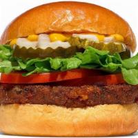 Veggie Burger  · A Black Bean Quinoa Burger patty served with lettuce, tomatoes, red onions, pickles and must...