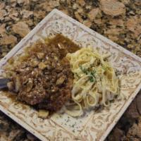 Chicken Marsala · Lightly floured chicken topped with fresh mushrooms and sweet marsala wine sauce served on a...
