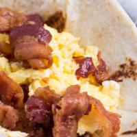 #102. Egg And Bacon Breakfast Taco · Add cheese for an additional charge.