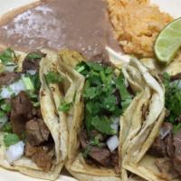 Flour Taco Lengua · All tacos served with onions, beans, cilantro, green salsa or red.
