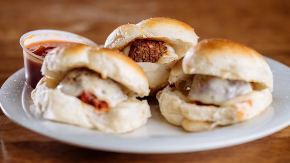 Meatball Sliders (3) · Handmade meatballs, oven fresh garlic knots with mozzarella, parmesan and marinara.