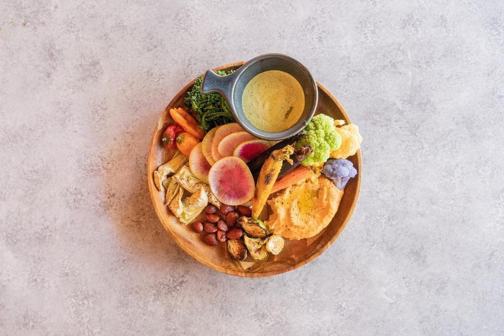 The Bounty · roasted heirloom carrot, cauliflower, broccolini, sweet pepper, blistered brussels sprouts, roasted artichoke, watermelon radish, almond hummus, side of green goddess dressing