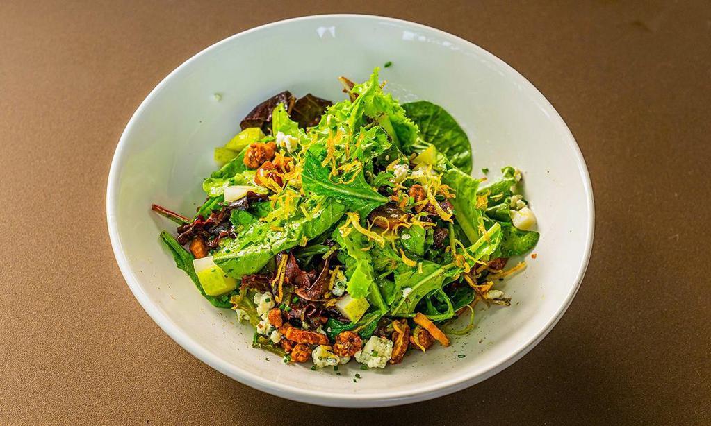 Mixed Greens Salad · Greens with shaved pears, candied pecans, red grapes, gorgonzola, and crispy leeks with poppyseed vinaigrette. All dressings will be served on the side.