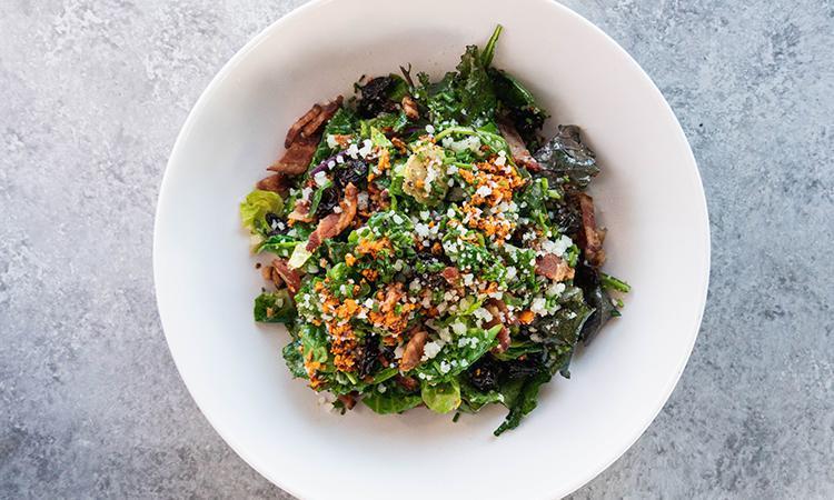 1/2 Brussels Sprout Salad · Kale, romaine, Brussels sprouts, manchego, spicy marcona almonds, bacon, dried cherries with lemon manchego dressing. *All dressings will be served on the side.