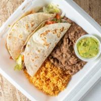 Fajitas Taco Platter · Two soft beef fajita tacos served with, Spanish rice, re-fried beans and guacamole and sopai...