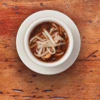 French Onion Soupe · Our beef broth based soupe filled with tender onions and flavorful spices. Garnished with Sw...