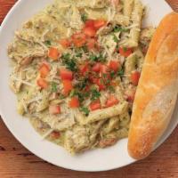 Pesto Pasta (Chicken) · Penne pasta sautéed in our house-made pesto cream sauce with balsamic-marinated chicken and ...