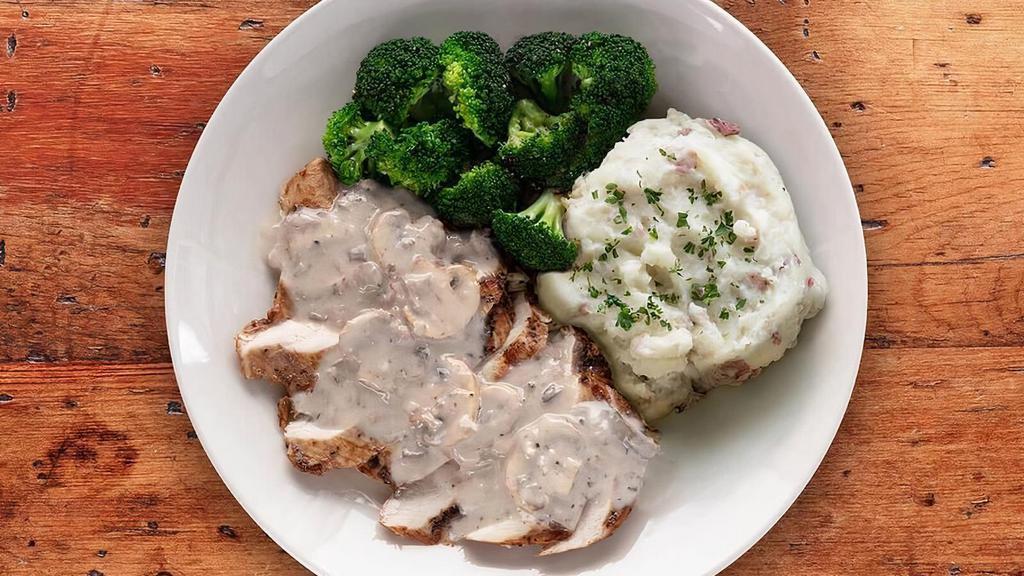 Chicken La Madeleine · Our signature balsamic-marinated chicken topped with creamy wild mushroom sauce, served with your choice of sides.