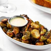 Crispy Brussels Sprouts · caramelized onions, bacon.