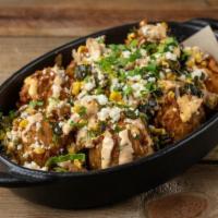 Txmx Titan Tots  · house-made tots, chicken guisado, roasted corn, poblano peppers, frickin spicy ranch, cilant...