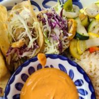 Tacos De Pescado (3) · Mahi mahi fish cooked in olive oil, garlic, cabbage tomatoes & onions. Served with white ric...