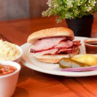 Ham Sandwich Plate · Slices of hickory-smoked ham served on a toasted sesame seed bun with your choice of two hom...