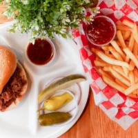 Chopped Brisket Sandwich · Slow-smoked brisket marinated in our homemade barbeque sauce served on a toasted sesame seed...