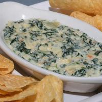 Three-Cheese Spinach Dip · A creamy blend of fresh spinach, artichoke hearts, white American, parmesan, and romano chee...