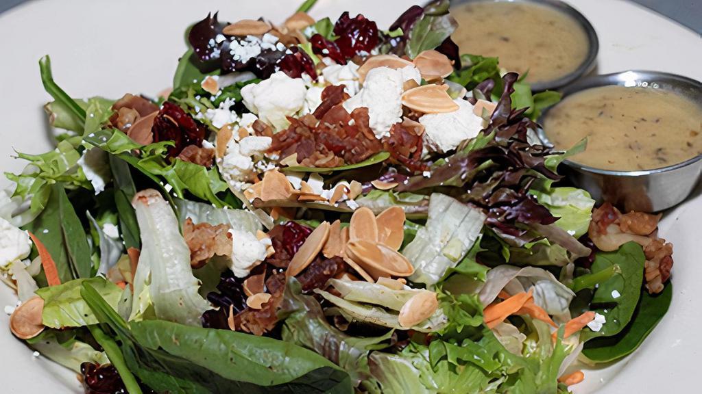Large Harvest Salad · Mixed greens, chopped apples, dried cranberries, bacon, toasted almonds, and feta cheese. Served with our housemade herb vinaigrette.