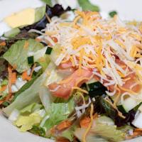 Large Traditional Salad · Mixed greens, tomatoes, cucumbers, cheddar-jack cheese, and hard boiled egg. Served with our...