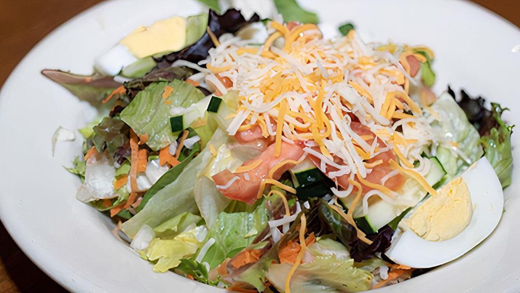 Large Traditional Salad · Mixed greens, tomatoes, cucumbers, cheddar-jack cheese, and hard boiled egg. Served with our homemade buttermilk ranch dressing.