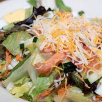 Small Traditional Salad · Mixed greens, tomatoes, cucumbers, cheddar-jack cheese, and hard boiled egg. Served with our...