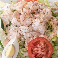 Shrimp & Crab Louis Salad · Lump crab meat and shrimp tossed with our homemade remoulade on a bed of shredded iceberg le...