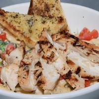 Grilled Chicken Alfredo Pasta · Grilled chicken breast, sautéed broccoli, tomatoes, and penne pasta tossed in our garlic alf...