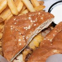 Kid Cheeseburger · A quarter pound burger topped with cheddar-jack cheese served on a toasted bun. Served with ...
