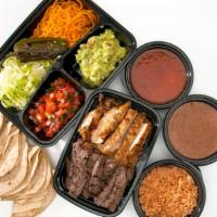 Fajitas For 4 · Served with fresh hand-rolled tortillas and sides of grilled onions, jalapeños, shredded che...