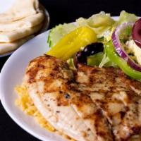 Grilled Tilapia · Char-grilled tilapia over rice with Greek salad.