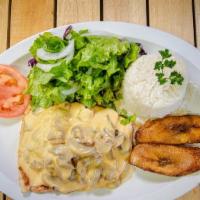 Chicken Breast In Mushroom Sauce · Served with rice, salad and sweet plantain.