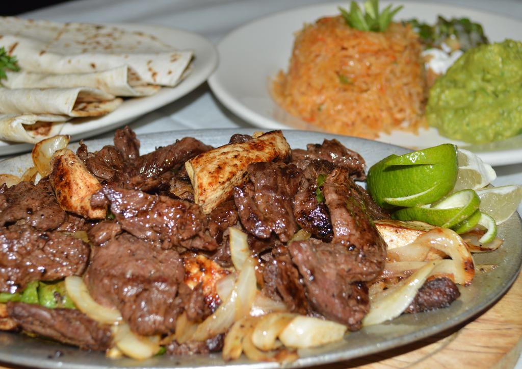 Fajita · Beef or mixed with chicken. Grilled fajita served with rice, beans, pico de Gallo, Guacamole, sour cream and tortilla.