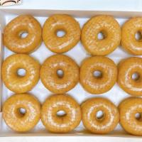 6 Glazed Donut · A box filled with glazed donuts.