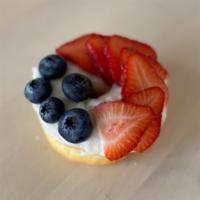 Berry Cheesy · Yeast Donut with House-Made Cream Cheese Frosting on top with sliced Strawberries and Bluebe...