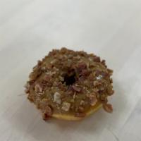 Maple Bacon · Yeast Donut dipped with Maple Glaze with Bacon bits on top.
