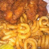 Wing Basket · Wings with fries side of pickles and peppers.