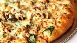 Nutty Chicken · Roasted cashews, roasted chicken, fresh mushrooms, spinach, grated parmesan and mozzarella.