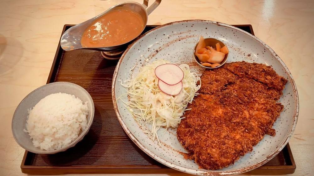 Curry Katsu · Japanese curry over pork cutlet.