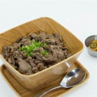 Gyudon · Marinated beef over a bowl of rice with onion, egg and donburi sauce.